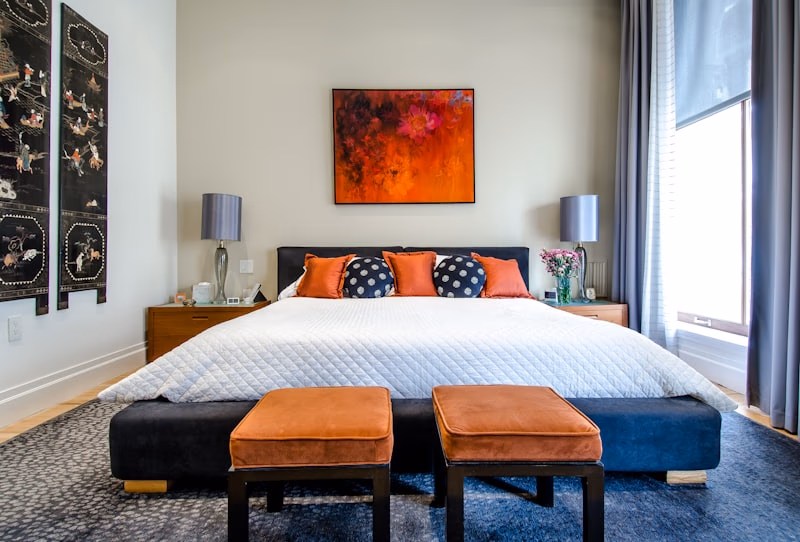 Layered double curtains with sheer and blackout fabrics installed in a modern bedroom